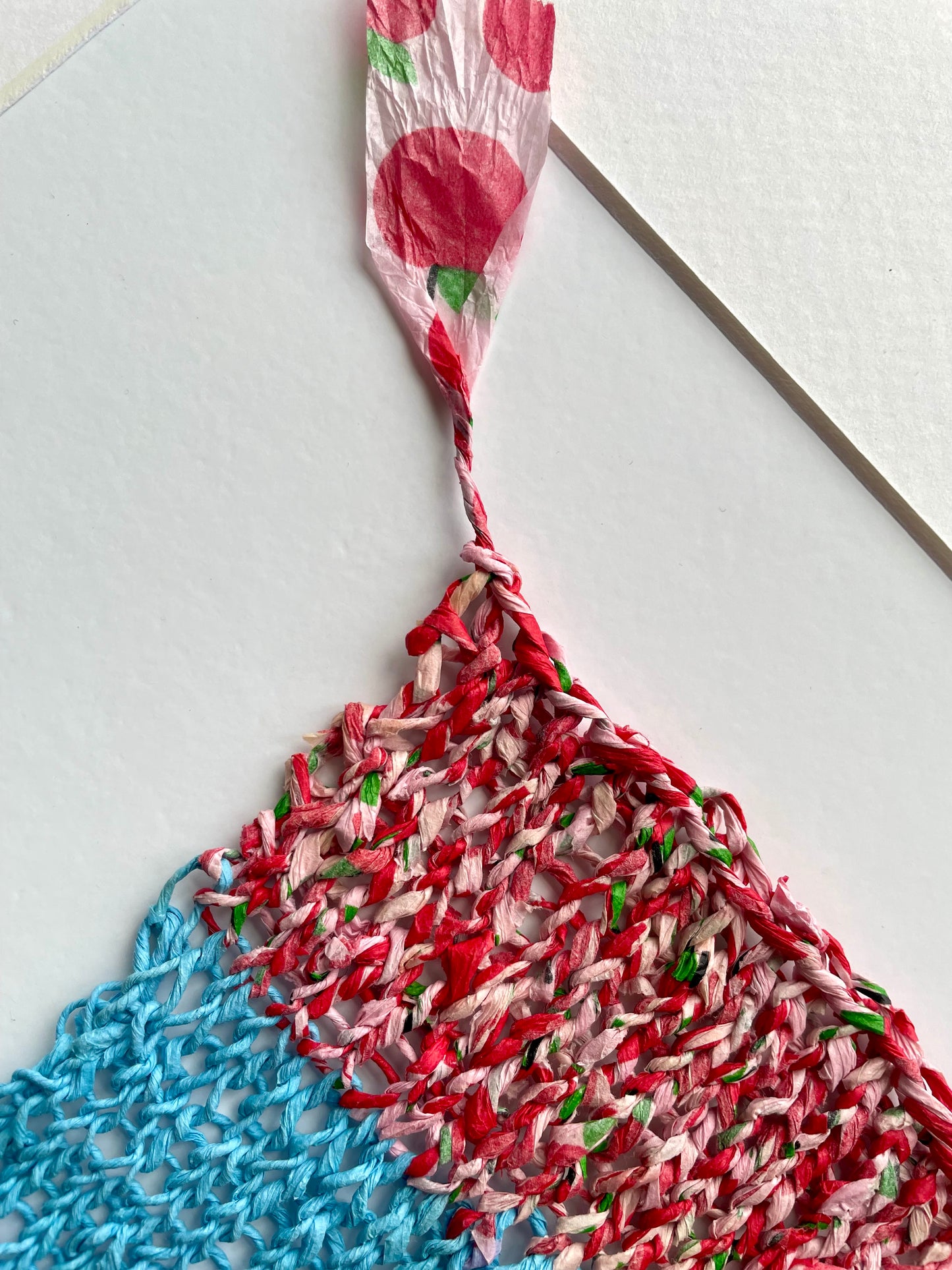 Study with knitted tissue paper in blue and apple print