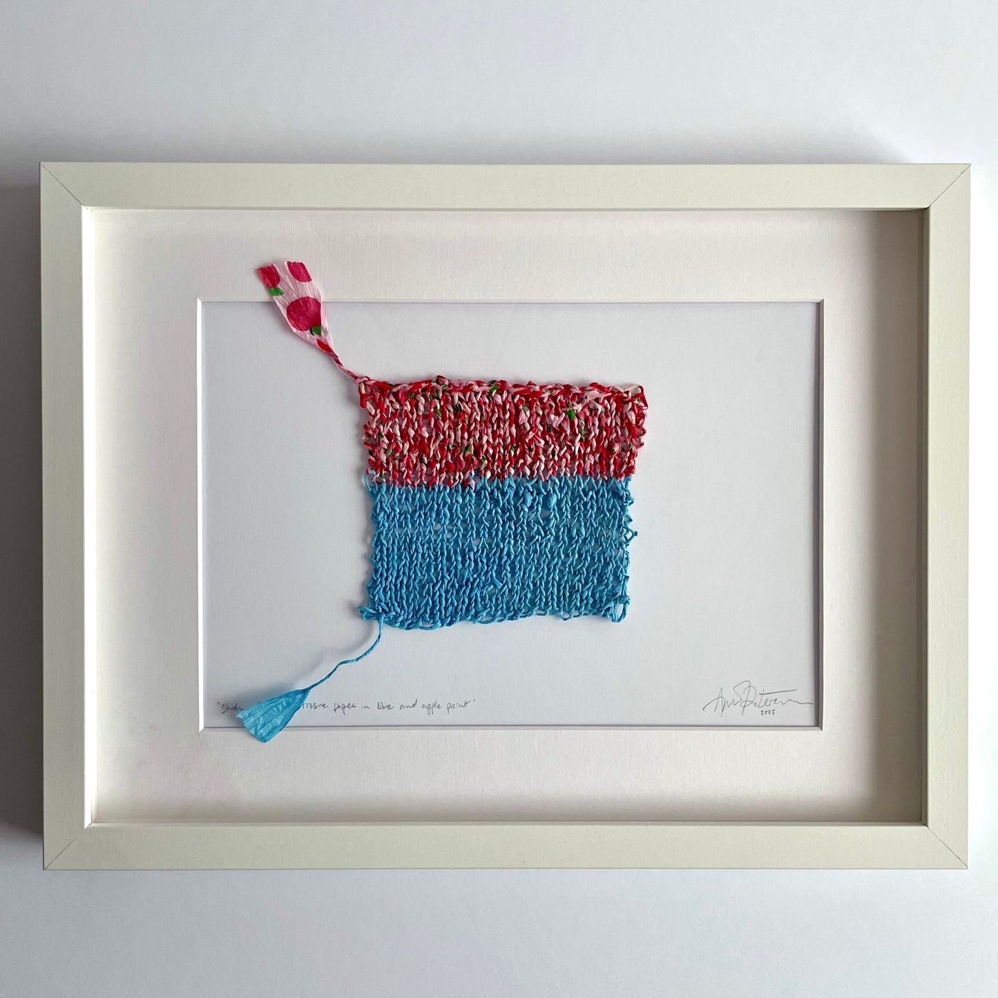 Study with knitted tissue paper in blue and apple print